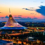 The twilight skyline of Astana, Kazakhstan, offers a visual metaphor for the nation's recent energy upheaval as a daylight-saving time change disrupted power use and grid stability.