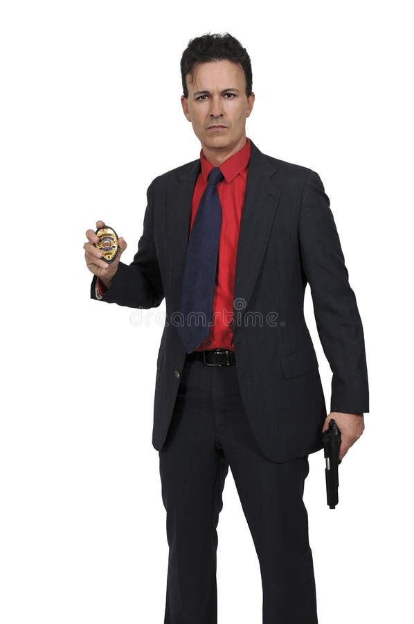 A police officer holds a badge and a firearm, symbolizing the authority and responsibility of law enforcement.