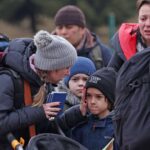 A Ukrainian family, including children, prepares for a journey amid the fallout of conflict, as a network of international fraudsters exploits their vulnerability.