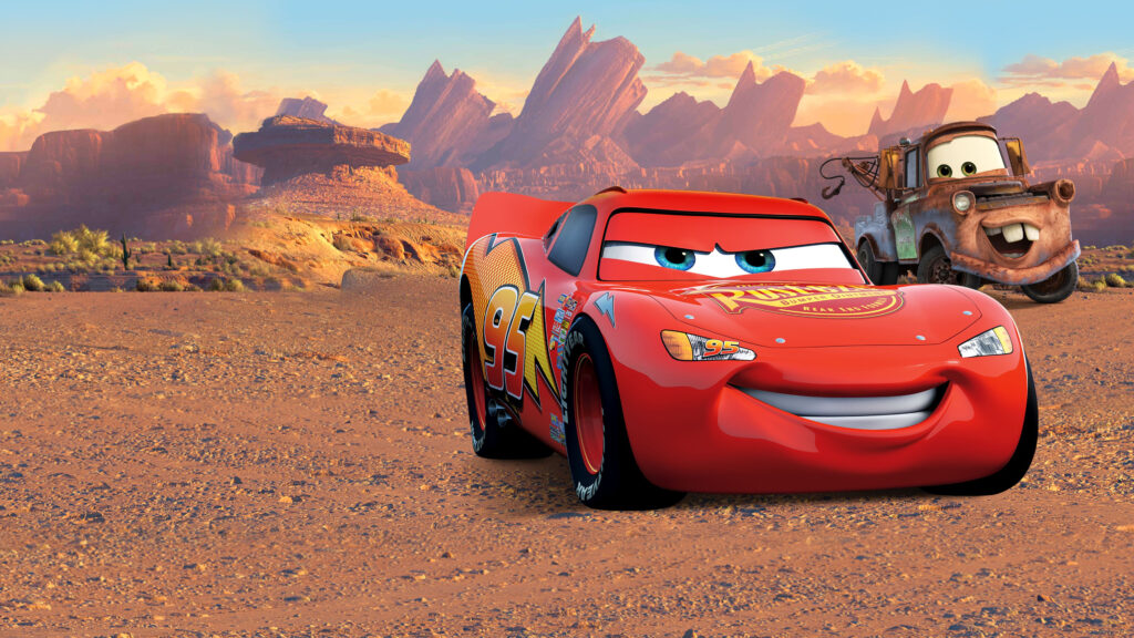 Lightning McQueen and Mater navigate a desert road, symbolizing the spirit of adventure and the challenges of the road ahead.