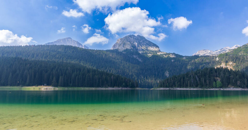 The picturesque Durmitor lakescape, where a tourist incident has triggered an investigation into potential fraud, raises questions about the region's safety and administrative oversight.