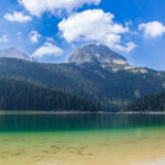 The picturesque Durmitor lakescape, where a tourist incident has triggered an investigation into potential fraud, raises questions about the region's safety and administrative oversight.