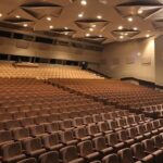 The silent, empty auditorium of Latvia's Dailes Theatre stands as a stage for controversy, amid claims of toxic management culture.